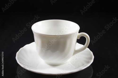 Coffee cup with saucer on the table
