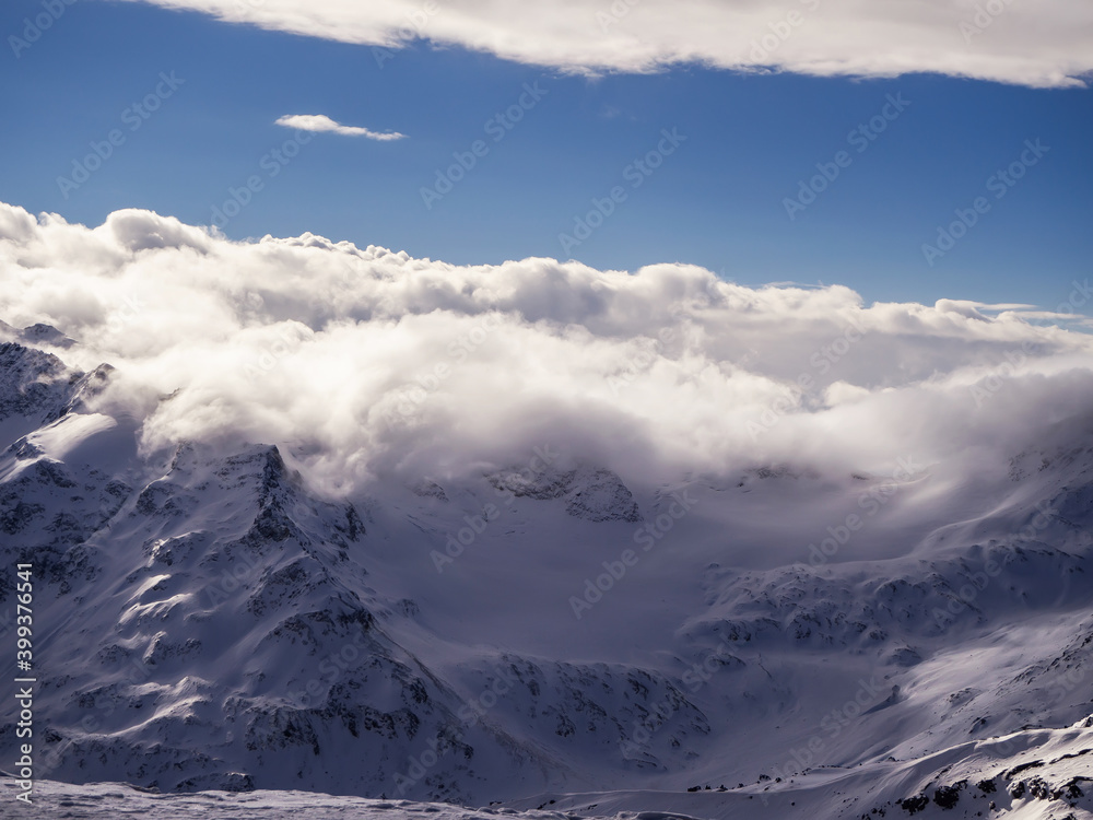 Top view of winter mountains covered with clouds Top view of winter mountains covered with clouds