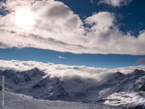 Top view of winter mountains covered with clouds © alexkazachok