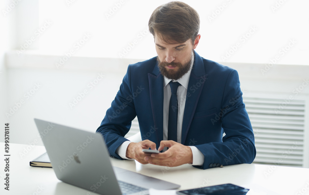 business man in classic suit at the table in the office business man in classic suit at the table in the office