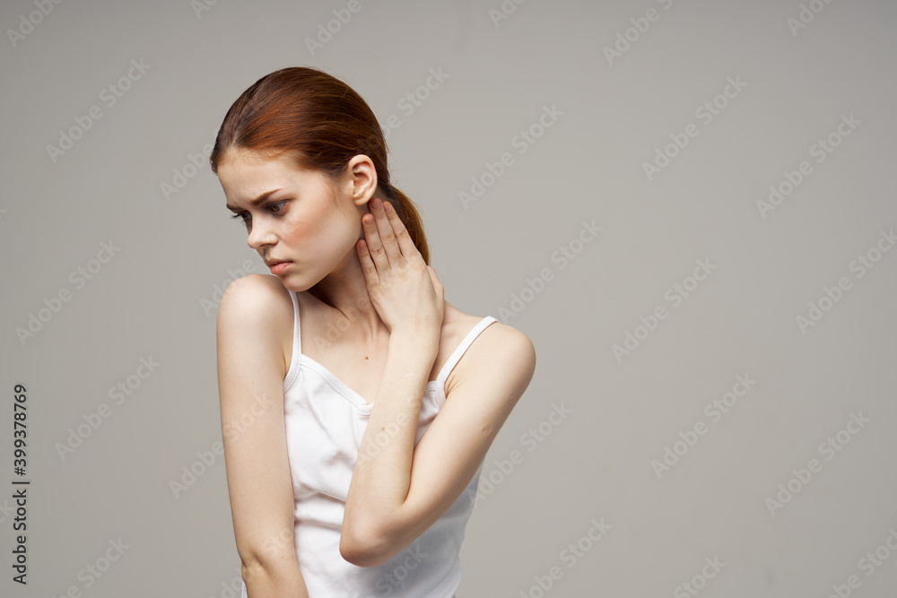 woman on gray background touching herself with hands Copy Space Model white t-shirt woman on gray background touching herself with hands Copy Space Model white t-shirt