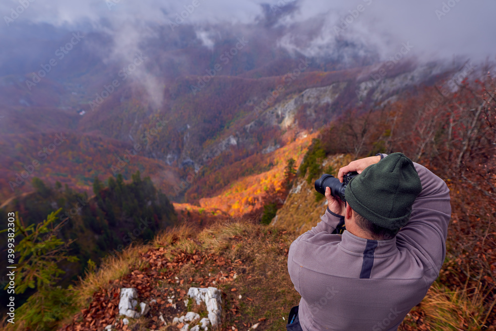 Professional nature photographer in the mountains