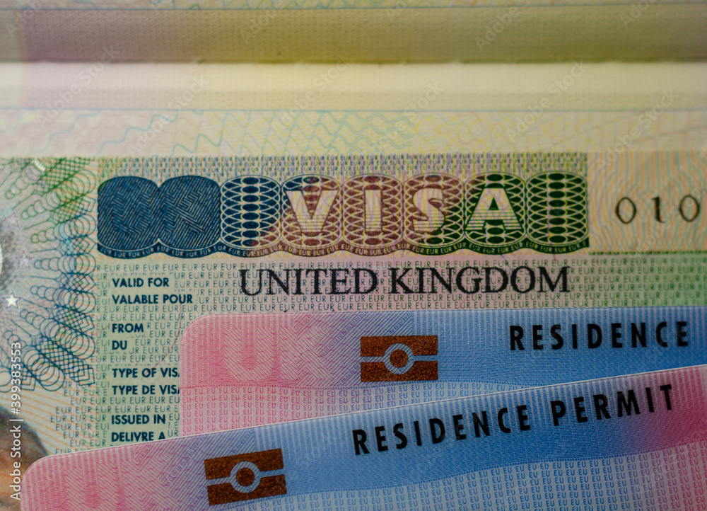 United Kingdom BRP (Biometrical Residence Permit) cards for Tier 2 work visa  placed on top of UK VISA sticker in the passport. Close up photo. Stock  Photo | Adobe Stock