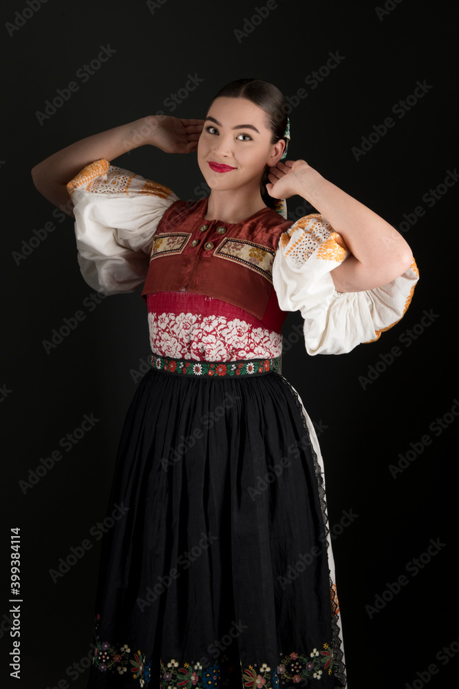 Young beautiful slovak woman in traditional dress. Slovak folklore Young beautiful slovak woman in traditional dress. Slovak folklore