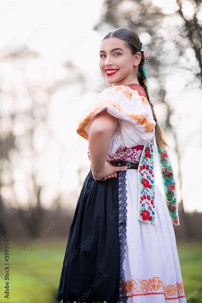 Young beautiful slovak woman in traditional dress. Slovak folklore Young beautiful slovak woman in traditional dress. Slovak folklore