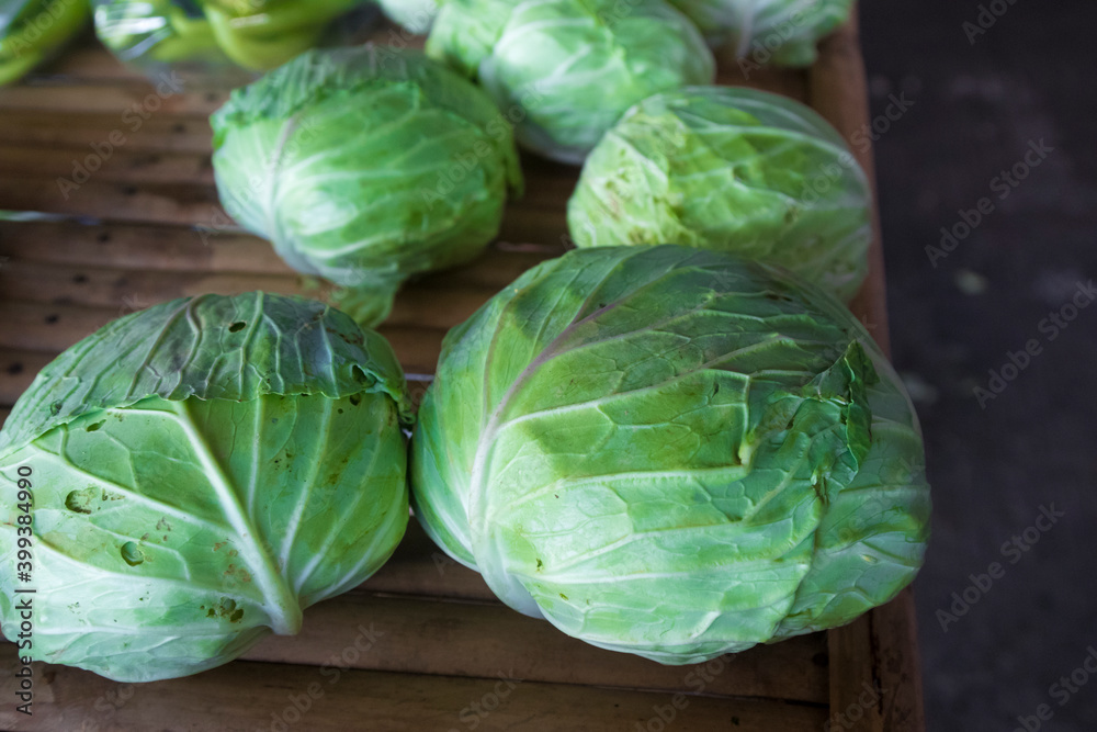 Fototapeta premium Fresh cabbages on a wooden table