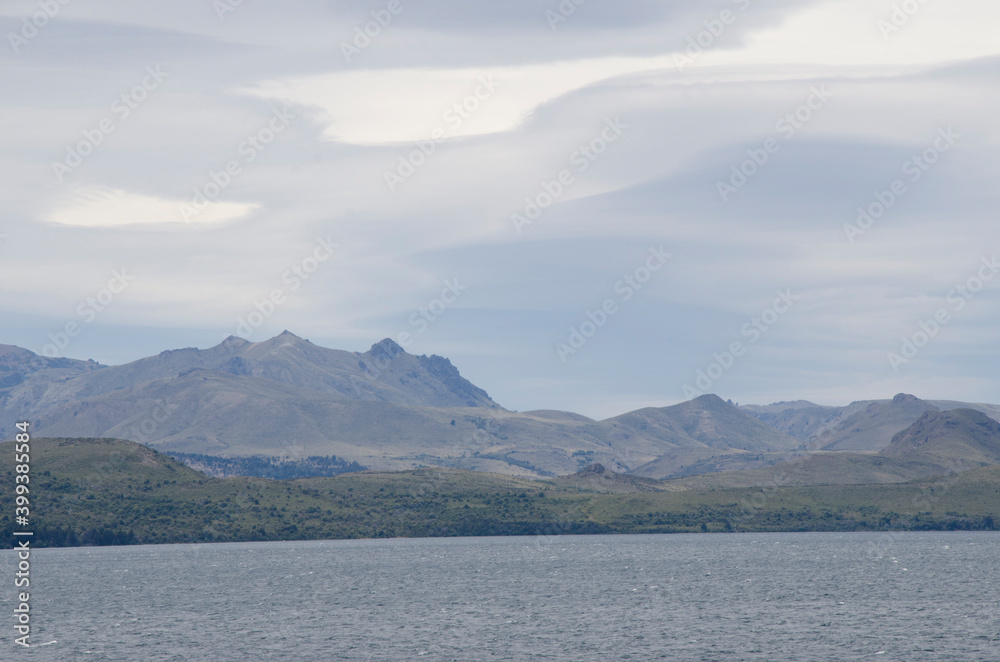 landscape of lake and mountains, cloudy and windy, bariloche, argentina