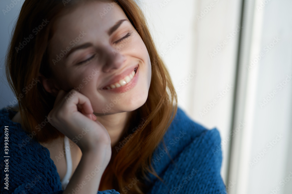 smiling woman hiding with a blanket near the window rest morning sun smiling woman hiding with a blanket near the window rest morning sun