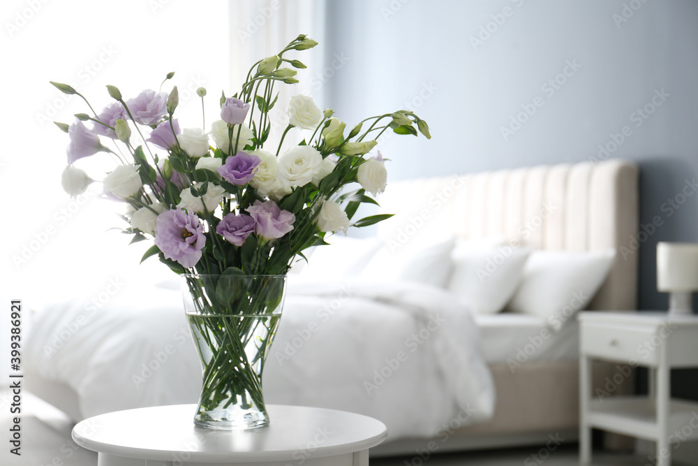 Beautiful bouquet with Eustoma flowers on table in bedroom. Space for text Beautiful bouquet with Eustoma flowers on table in bedroom. Space for text