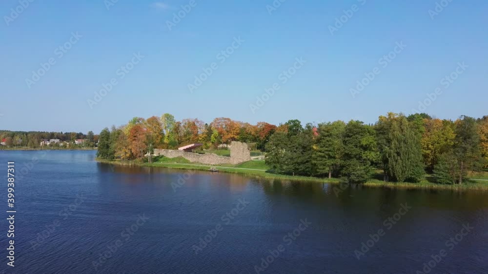 Aluksne Lake Largest Island Pilssala With Park and Ruins of the 14th Century Livonian Order Aluksne Castle in Latvia. Colorfull Autumn Lanscape. Aerial Dron Shot the Coasts and Islands of Aluksne Aluksne Lake Largest Island Pilssala With Park and Ruins of the 14th Century Livonian Order Aluksne Castle in Latvia. Colorfull Autumn Lanscape. Aerial Dron Shot the Coasts and Islands of Aluksne