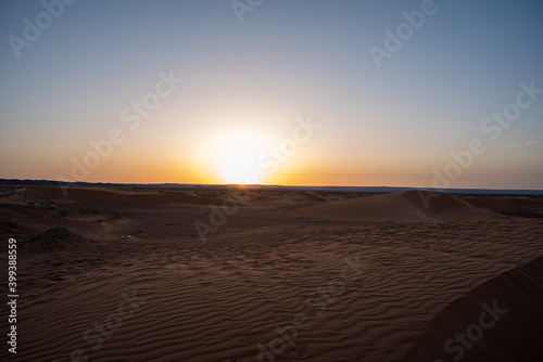 Merzouga  Erg Chebbi  Morroco  Africa - April 30  2019  Sun rises from the dunes