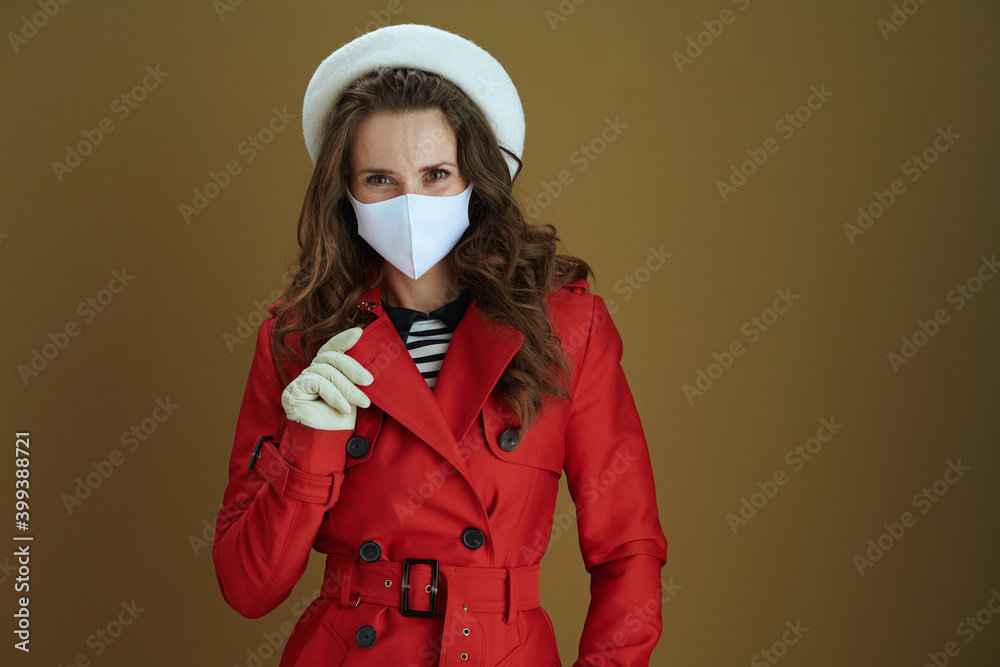 stylish woman in red coat isolated on brown background stylish woman in red coat isolated on brown background