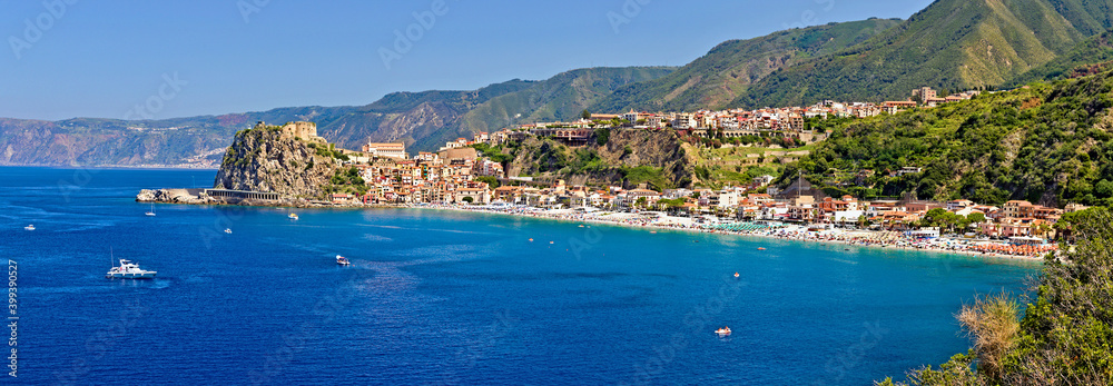 The southern coast of Scilla, Calabria, Italy, in midsummer, overlooking the bathing establishments and the old Ruffo Castle The southern coast of Scilla, Calabria, Italy, in midsummer, overlooking the bathing establishments and the old Ruffo Castle