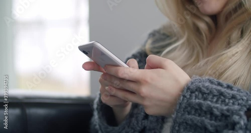 Wallpaper Mural Woman Texting Typing Scrolling on Mobile Phone Smartphone in Bright Living Room Torontodigital.ca