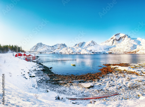 Stunning winter view of  fishing village on Sundstraumen strait and Kakern Bridge that separates Moskenesoya and Flakstadoya islands