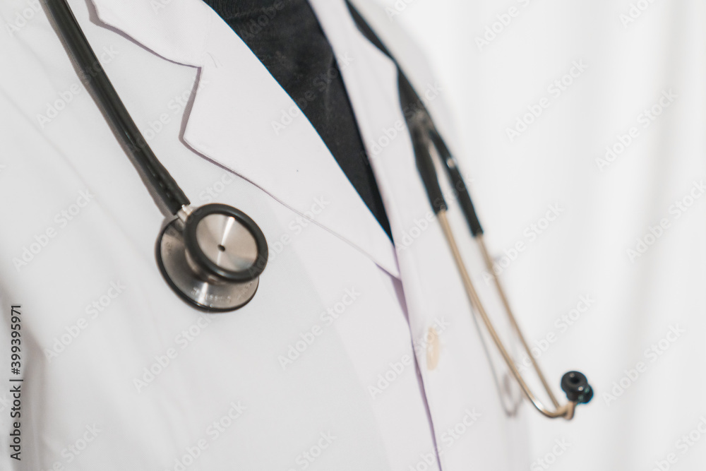 Doctor or physician in white dress uniform and stethoscope at the hospital or clinic Medical Technology, Health and Medical Concept. Physician With Stetoscope In Hospital Doctor or physician in white dress uniform and stethoscope at the hospital or clinic Medical Technology, Health and Medical Concept. Physician With Stetoscope In Hospital