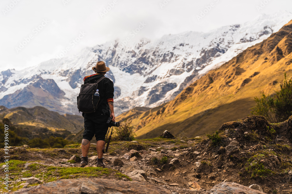 Man surrounded by high mountains Man surrounded by high mountains
