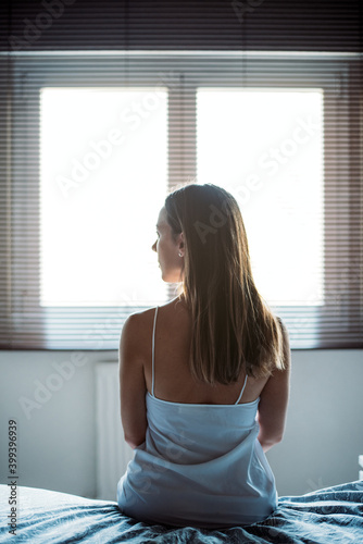 Unrecognizable woman in light room