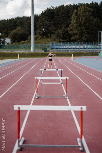 Sportswoman preparing for obstacle race photo