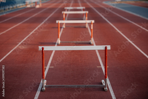 Row of metal barriers on empty treadmill
