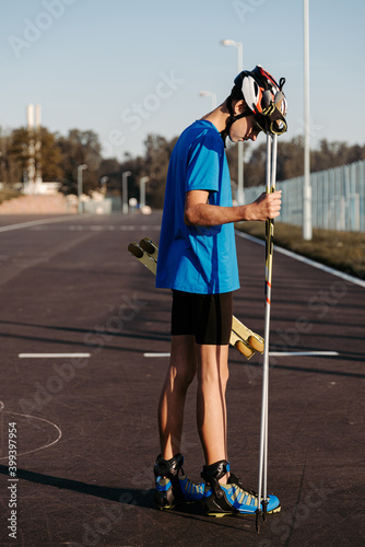 Teen athlete ready for roller skiing workout photo