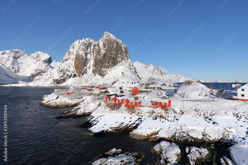 Outstanding winter view on Hamnoy village and Festhaeltinden mountain on background.