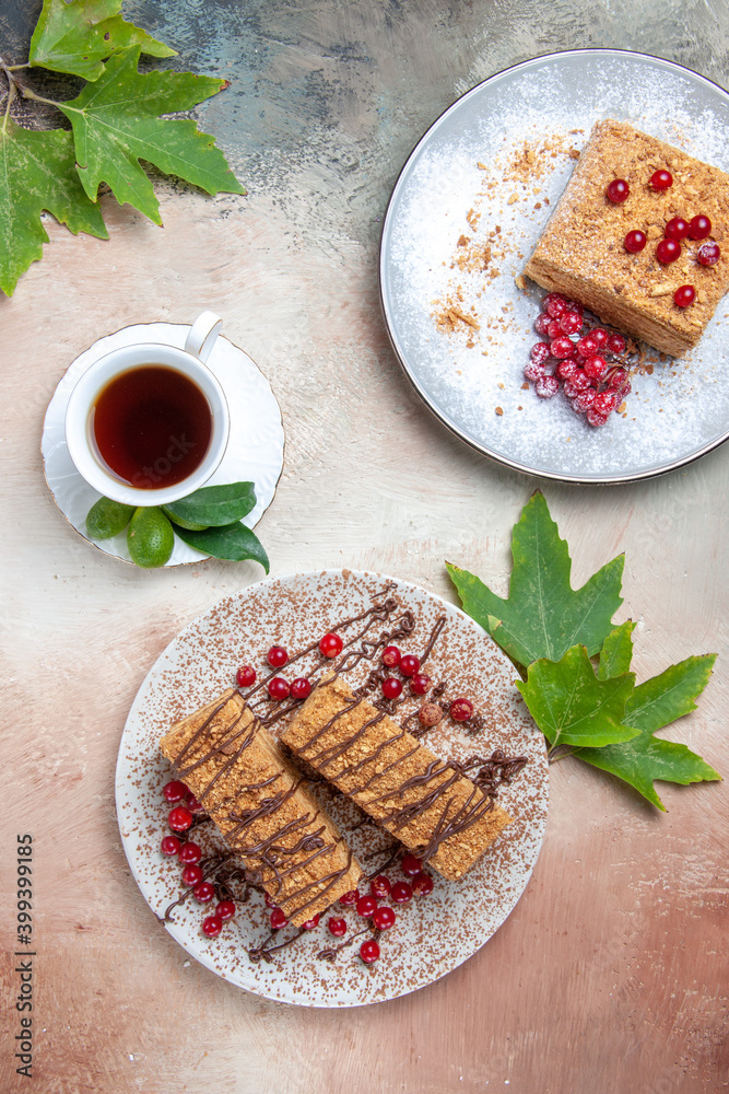 top view yummy cake slice with tea and berries on light background biscuit cake sweet top view yummy cake slice with tea and berries on light background biscuit cake sweet