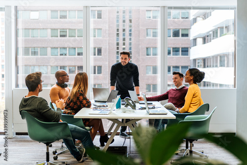 Coworkers having meeting in conference room photo