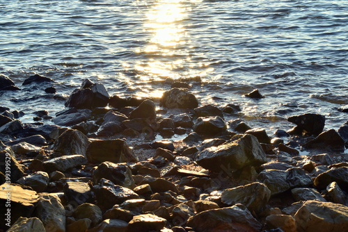 Rocks on the shore during sunset