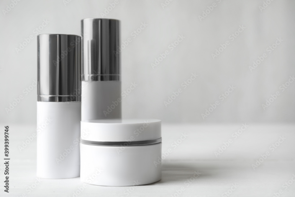 Set of luxury cosmetic products on white table. Space for text Set of luxury cosmetic products on white table. Space for text