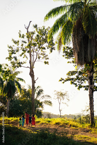 Group of panamanian kids walking with their dog