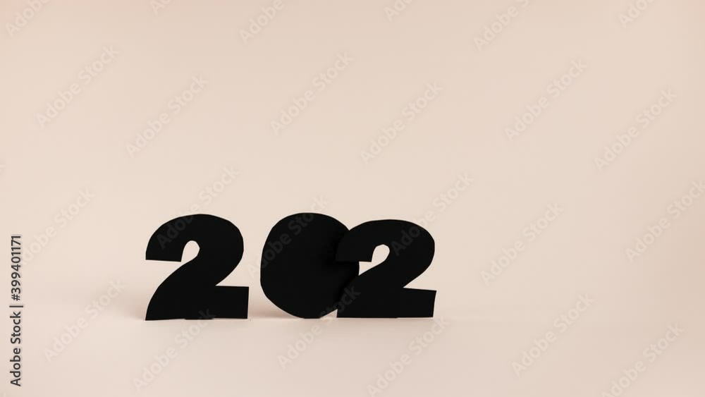 4K Stop motion video concept of end of the 2020 year. Leaving behind bad times of 2020 year. Burning numbers 2020. 4K Stop motion video concept of end of the 2020 year. Leaving behind bad times of 2020 year. Burning numbers 2020.