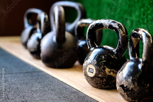 Close up of a few kettlebells. photo