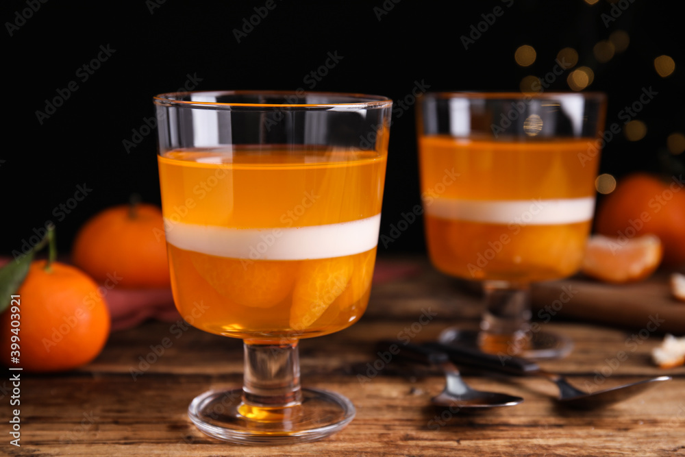 Delicious tangerine jelly on wooden table, closeup Delicious tangerine jelly on wooden table, closeup