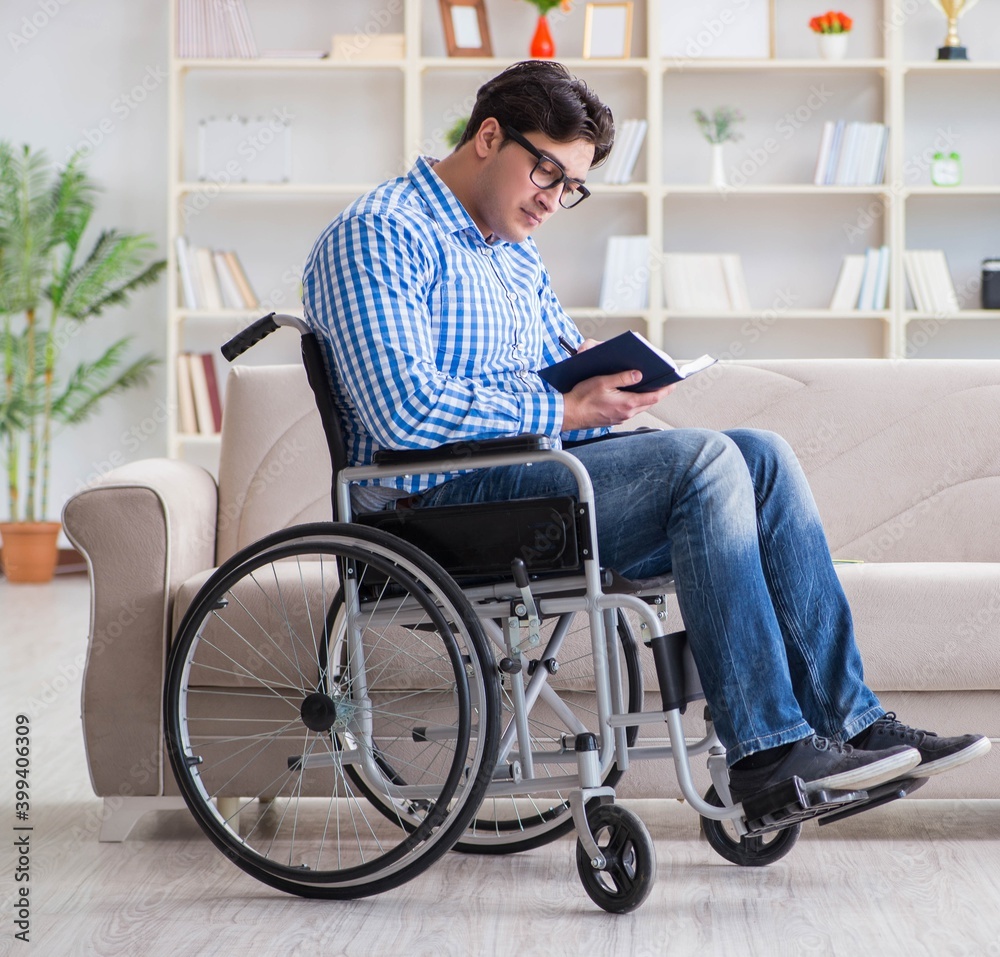 Young student on wheelchair in disability concept Young student on wheelchair in disability concept