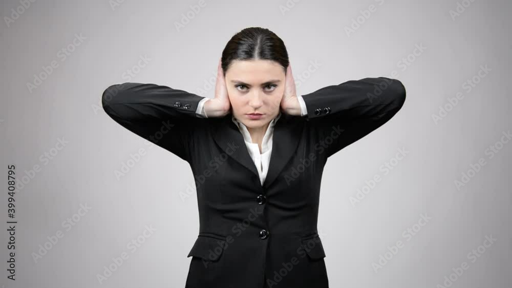 Beautiful young business woman does not want to hear the bad news Beautiful young business woman does not want to hear the bad news