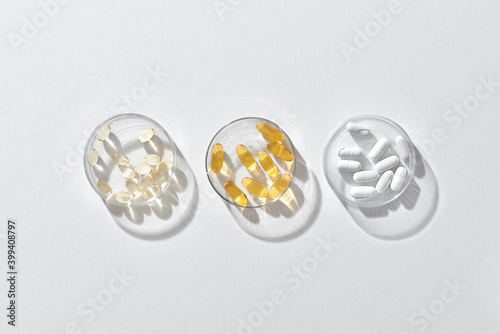 Vitamins on a white background spirulina, calcium, omega
