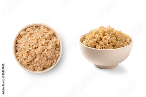 Cooked brown rice in white bowl isolated on white background.