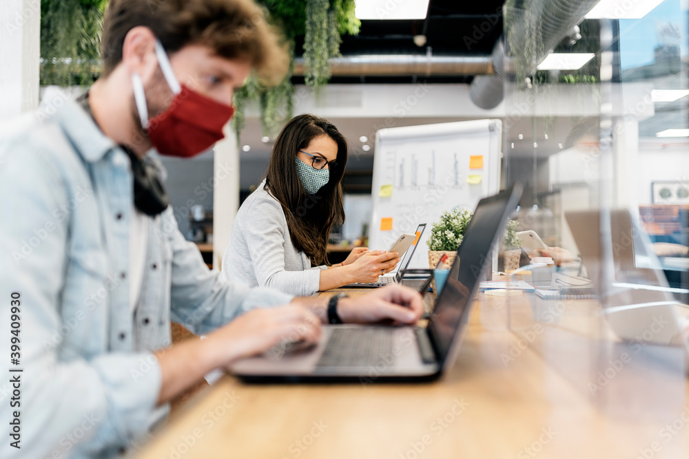 Portrait of Office Workers At Desk Wearing Face Masks Portrait of Office Workers At Desk Wearing Face Masks
