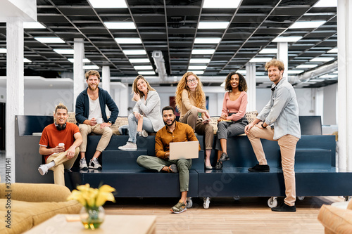 Young Work Team Smiling During Break Time in Office photo