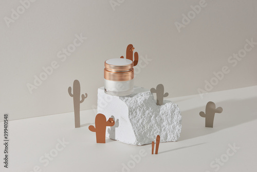 Face cream, elixir for beauty with cactus made from paper. Minimalism