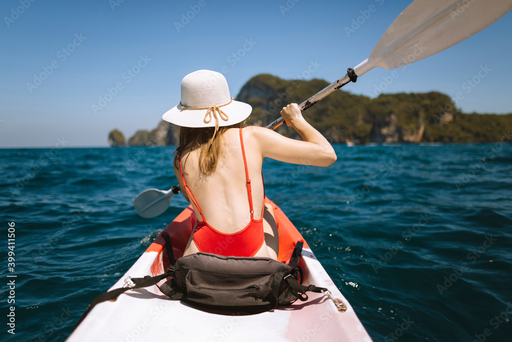 Young woman in kayak on sea in Krabi, Thailand Young woman in kayak on sea in Krabi, Thailand