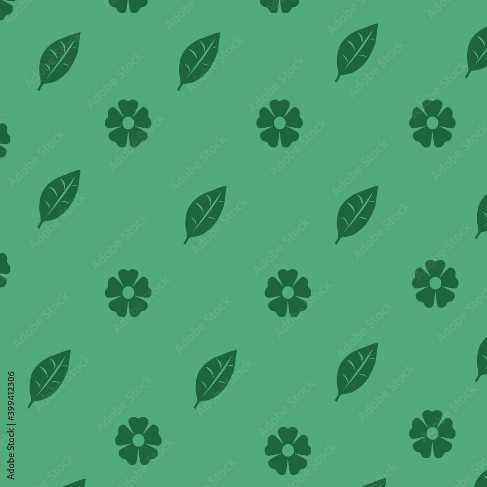 Spring flowers and leaves on green background