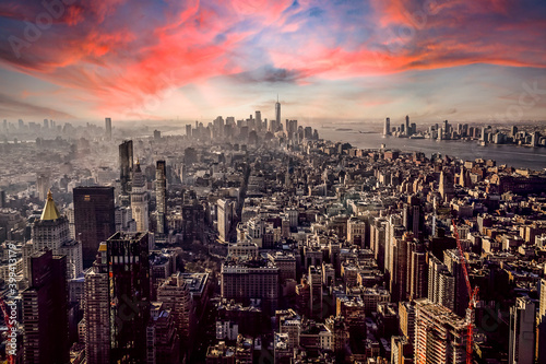 Aerial view of New York city against orange sky during sunset, New York, USA photo