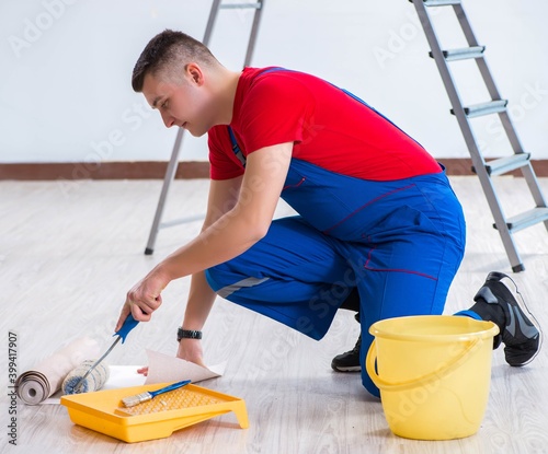 Contractor worker preparing for wallpaper decoration