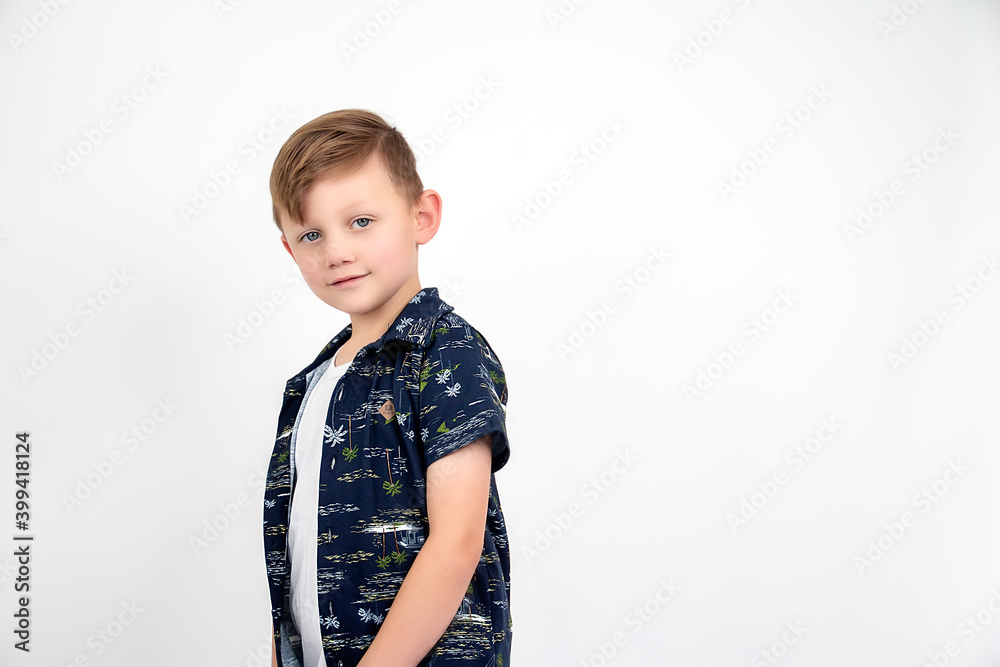 Five-year-old model with blue print shirt, half body, posing for the photo.
Five-year-old model with blue print shirt, half body, posing for the photo.