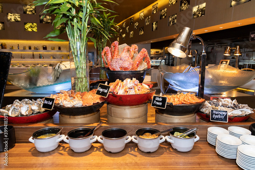 Seafood buffet station with oysters, king crab and prawns