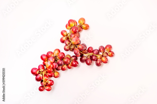 bunches of red grapes on white background