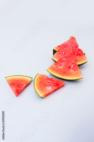 rectangular watermelon chunks on light blue tone table