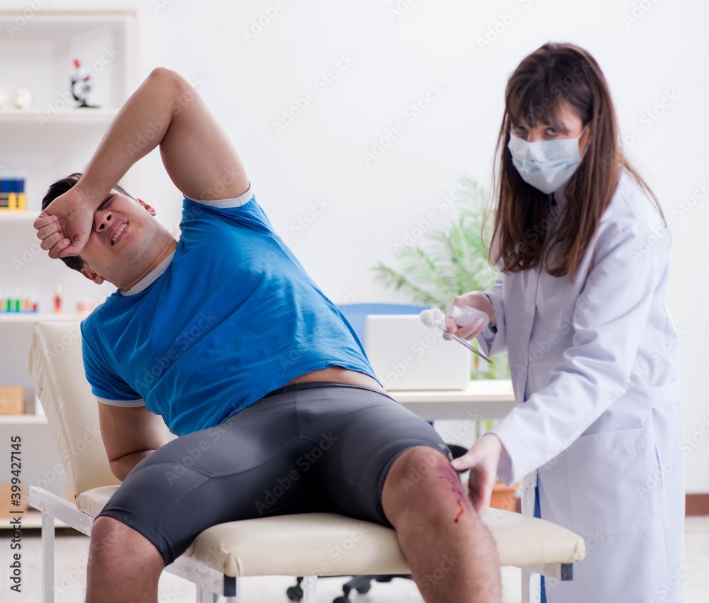 Patient visiting doctor after sustaining sports injury Patient visiting doctor after sustaining sports injury
